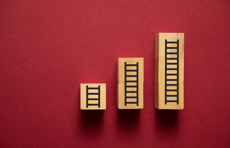 Ladders of success on wooden block.の写真素材