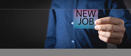 Man showing New Job message on sticky note.の写真素材