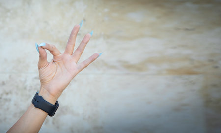 Caucasian young woman showing ok sign.の写真素材