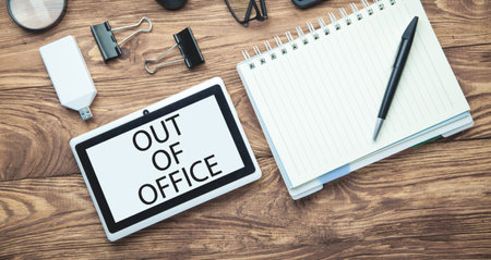 Out Of Office on tablet screen. Business conceptの写真素材