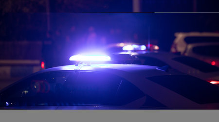 Blue light flasher. Police car at night time in the city