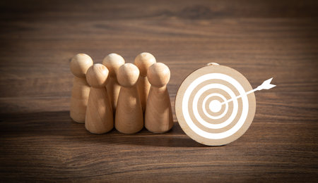 Target dart with a wooden people. Targetingの写真素材