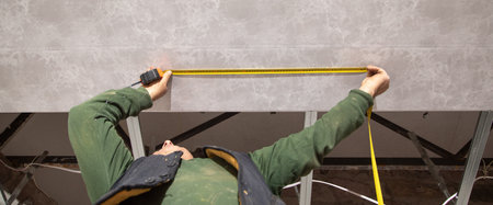 Measurement of ceiling connected to plastic frame.の写真素材