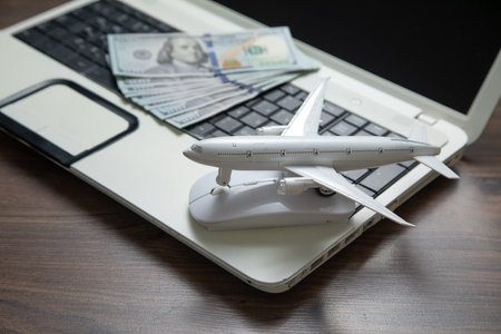 Toy airplane with a laptop computer.の写真素材