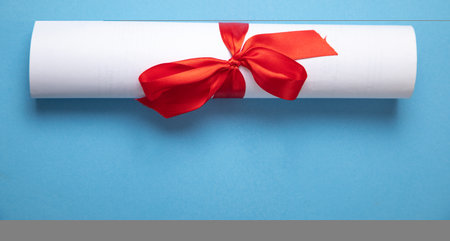 Diploma on the blue background.の写真素材