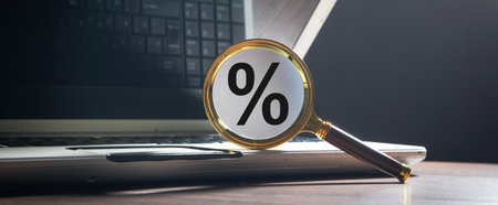 Magnifying glass with a percentage symbol.