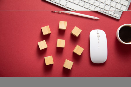 Empty wooden cubes with a computer keyboard and mouse.の写真素材