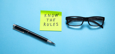 Know The Rules on sticky note on the blue background.の写真素材