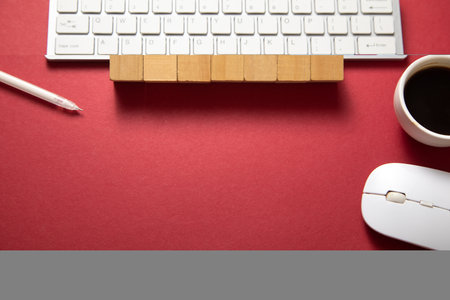 Empty wooden cubes with a computer keyboard and mouse.の写真素材