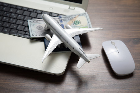 Toy airplane with a laptop computer.の写真素材