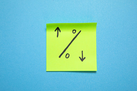 Percentage symbol on sticky on the blue background.の写真素材