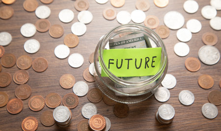 Jar of coins and word Future. Concept of saving money for future