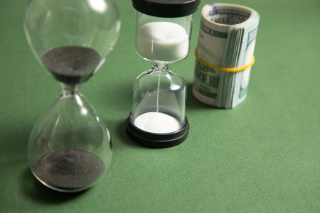 Hourglass with a dollar banknote. Businessの写真素材
