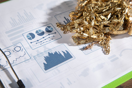 Golden jewelry on financial graphs.の写真素材