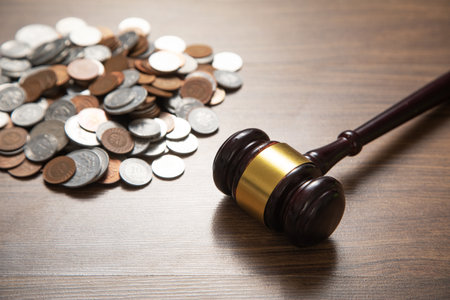 Stack of coins with judge gavel.の写真素材