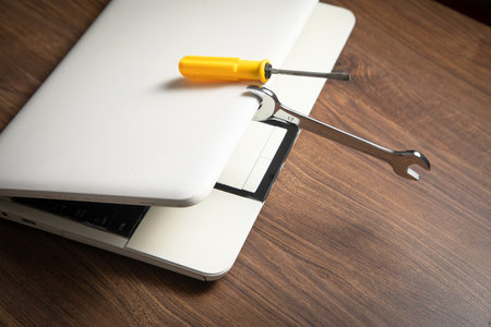 Wrench and screwdriver with a laptop computer. IT Service. Supportの写真素材