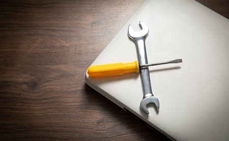 Wrench and screwdriver with a laptop computer. IT Service. Supportの写真素材
