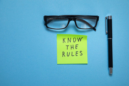 Know The Rules on sticky note on the blue background.の写真素材