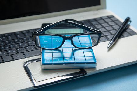 Black eyeglasses with a computer keyboard.の写真素材