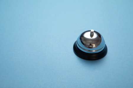Service bell on the blue background.の写真素材
