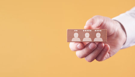 Human icons with positive and sad face, stars. Customer evaluation and satisfactionの写真素材