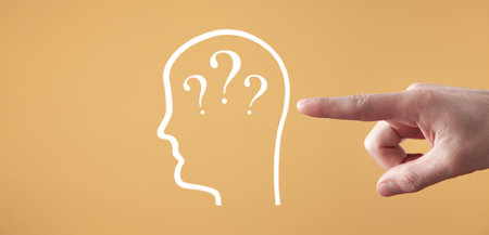Male hand showing human head with a question marks.の写真素材