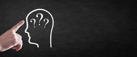 Male hand showing human head with a question marks.の写真素材