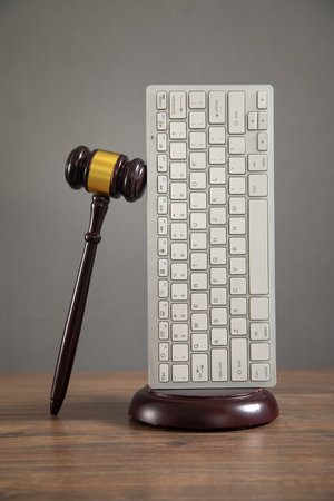 Judge gavel with a computer keyboard. Internet crimeの写真素材