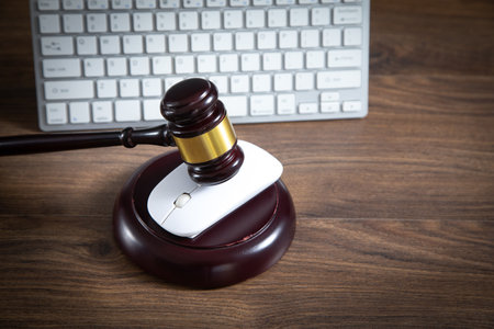 Judge gavel with a computer keyboard. Internet crimeの写真素材