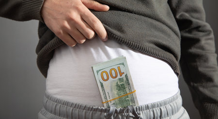 Man with money in his trousers.