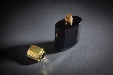 Bottle of perfume on the black background.の写真素材