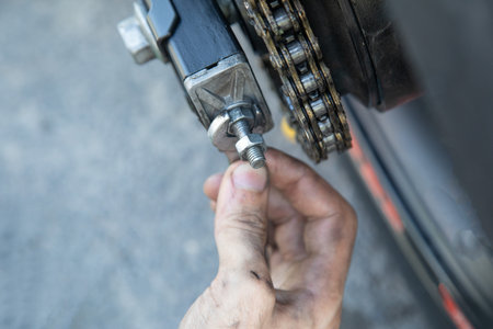 Man repairing motorcycle chain. Sport. Hobbyの写真素材