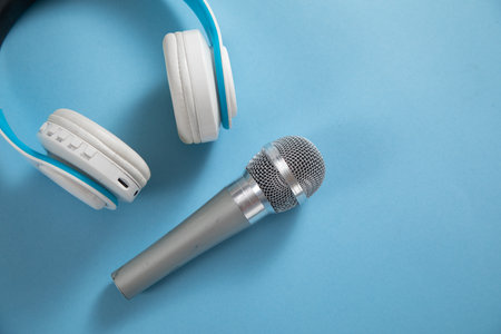 Headphones with a microphone on the blue background.