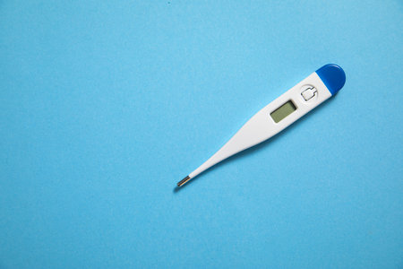 Thermometer on the blue background.