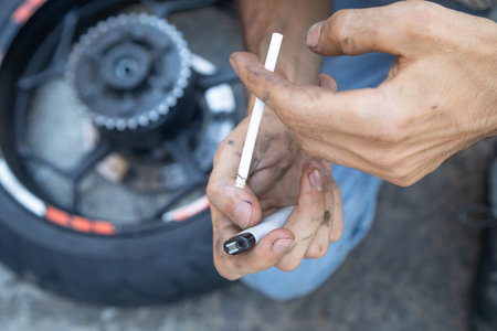 Caucasian man smoking cigarette in the outdoor.