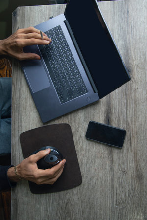 Man working in a computer at home.の写真素材