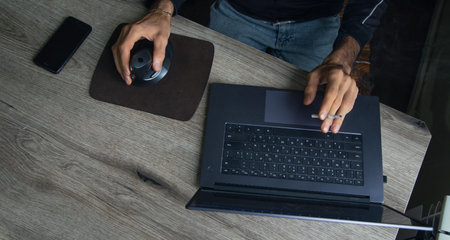 Man working in a computer at home.