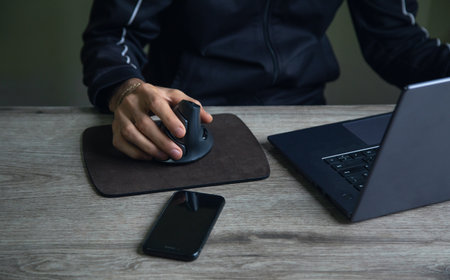 Man working in a computer at home.