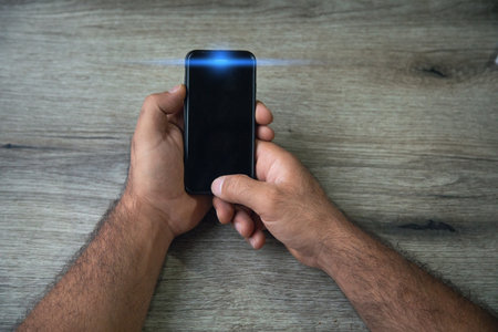 Person holding black smartphone. Technology. Lifestyleの写真素材