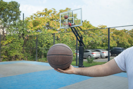 Basketball player holding ball. Sport. Hobby. Lifestyleの写真素材