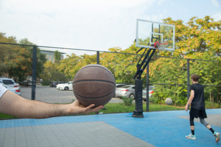 Basketball player holding ball. Sport. Hobby. Lifestyleの写真素材