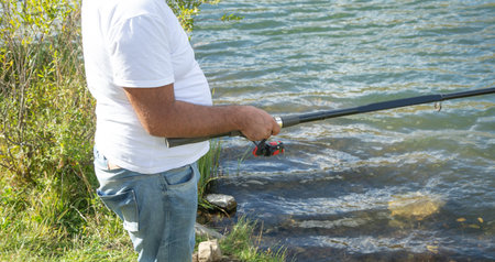Fisherman catches fish. Fishing. Hobby