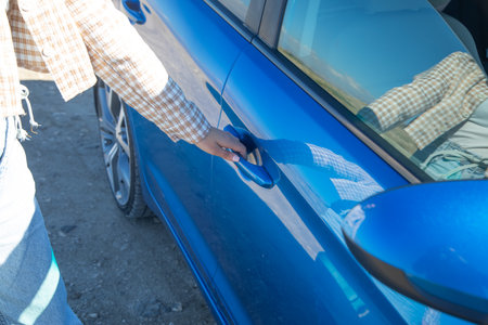 Woman opening car door. Hobby. Transportの写真素材