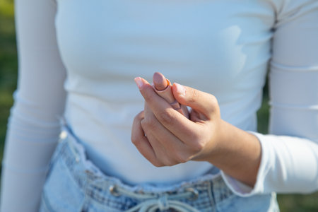 Young woman showing lipstick. Beauty. fashionの写真素材