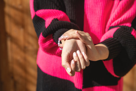 Young caucasian woman suffering from pain in hand.の写真素材