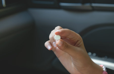 Caucasian female hand showing pill. Healthcare. Medical