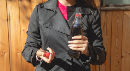 Young woman with bottle of juice.の写真素材
