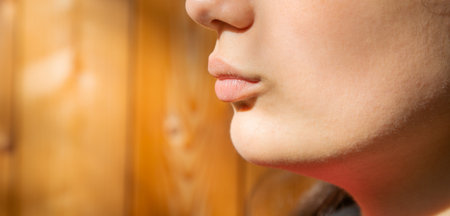 Closeup of mouth of young woman.の写真素材