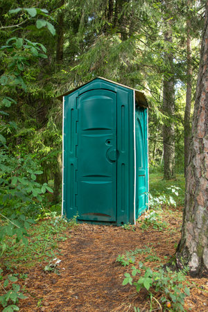 Outdoors toilet in green forest.の写真素材