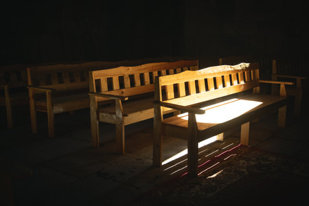 Bench at the church. Sun shines inside